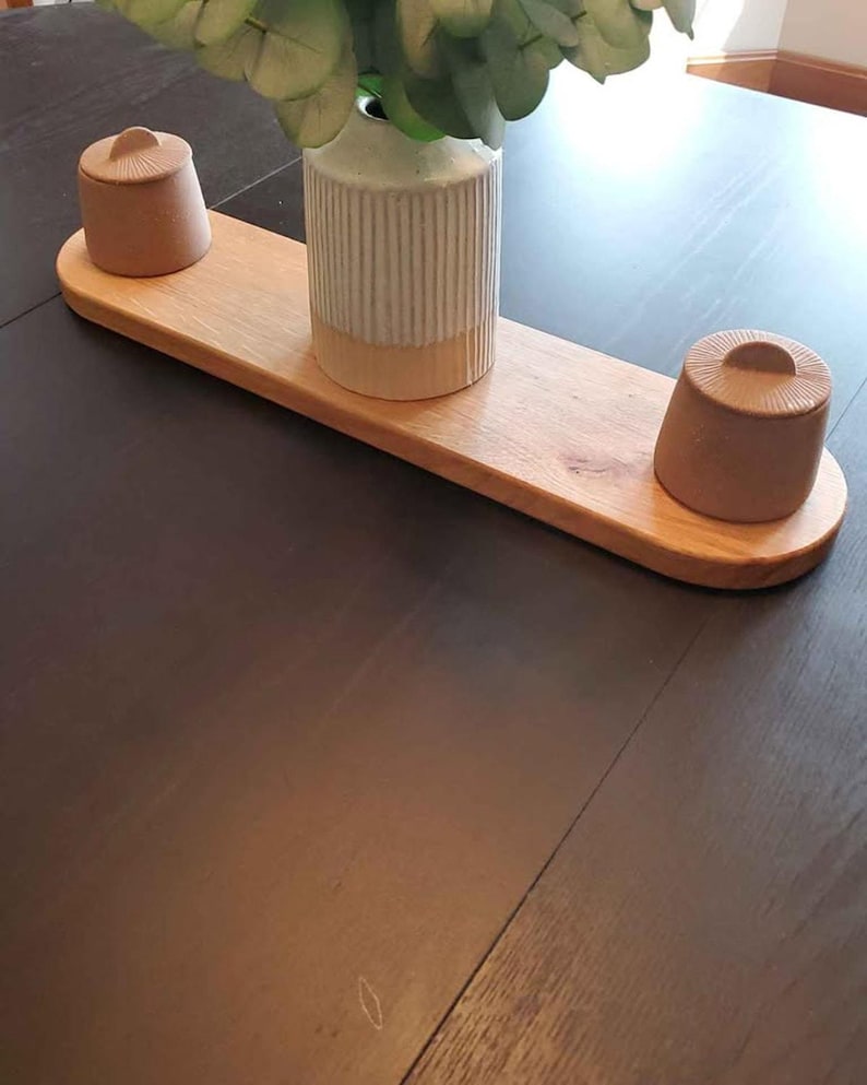 Solid oak table runner centerpiece styled with candles and greenery