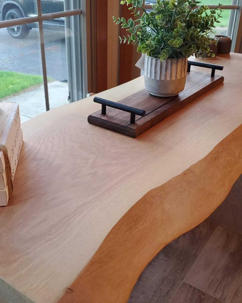 Walnut serving board with black epoxy inlay and steel handles