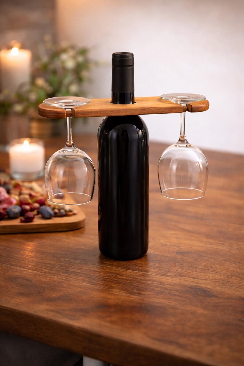 Pine wine caddy carrying two glasses on a wine bottle