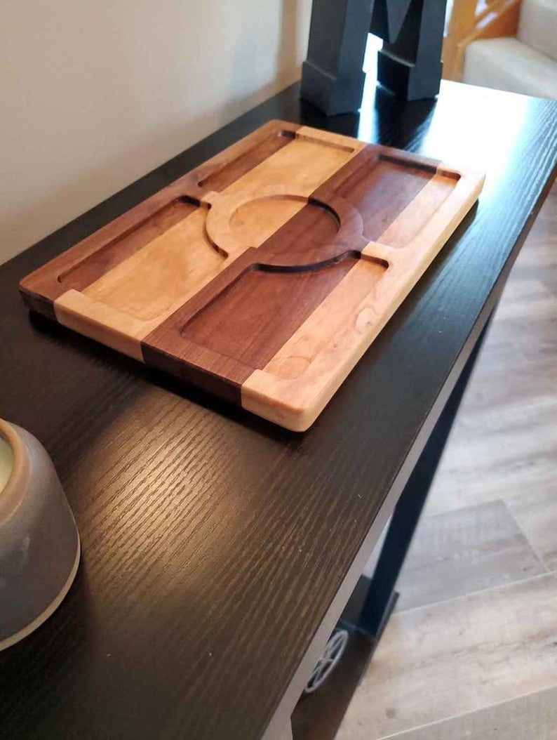 Empty Waypoint maple and walnut valet tray showing its routed compartments